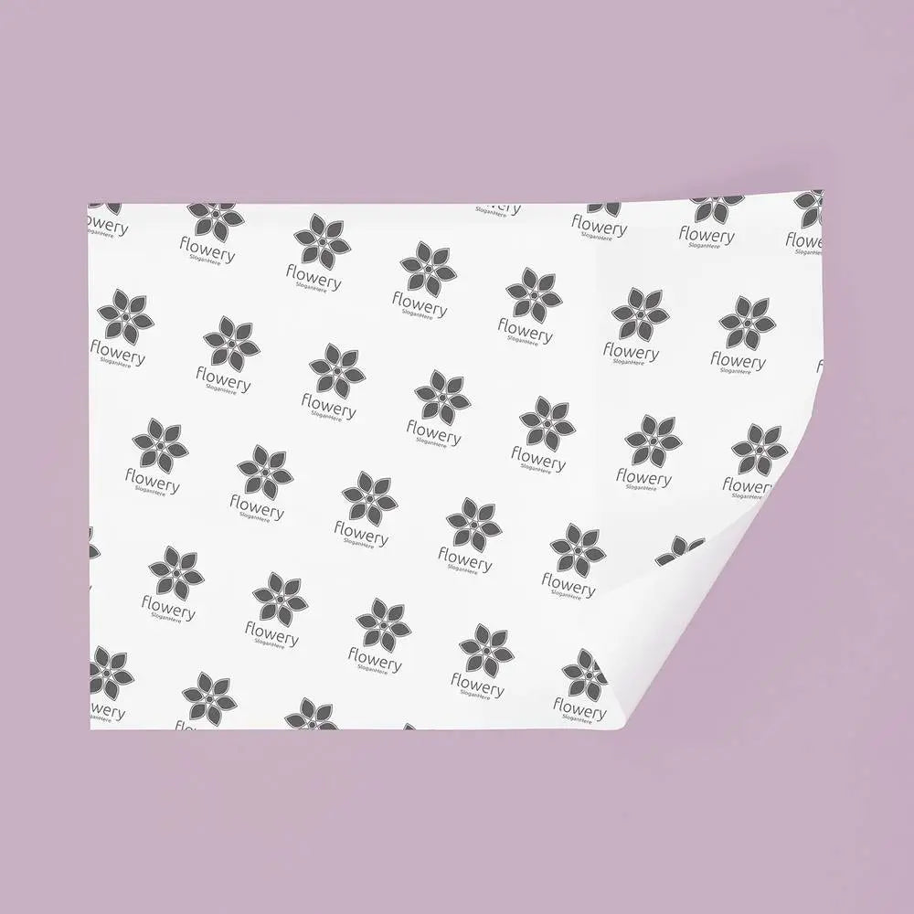 Wrapping Paper - Stylish and Versatile for Any Occasion featuring black floral 'flowery' print on white sheet, ideal for food service packaging.