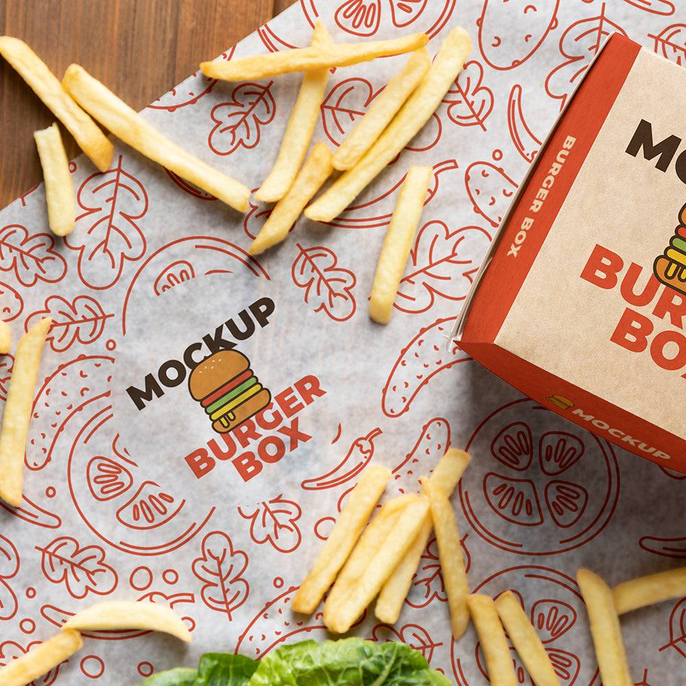 Grease-resistant sandwich paper with red burger-themed graphics, used for wrapping fries and burgers in food service packaging.