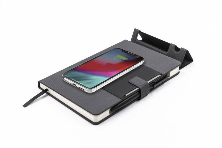 Santhome Wireless Deluxe Notebook 15W by KAMEZ with built-in phone stand and wireless charging, ideal for tech-savvy professionals.