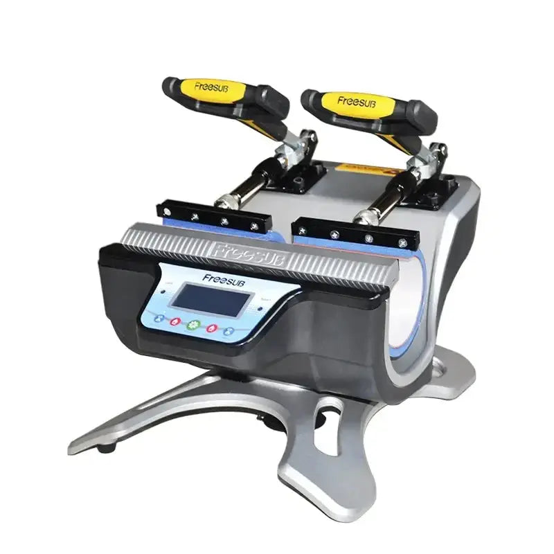 Front angled view of Double Station Heat Press Sublimation Machine ST-210 featuring dual mug clamps and digital control panel for high-volume printing.