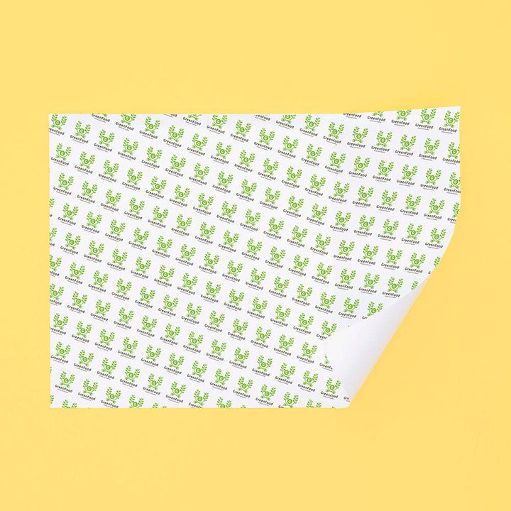 Eco-friendly sandwich paper with green food-themed icons, designed for safe and sustainable food packaging in the take-out industry.