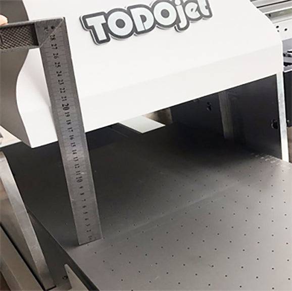 Measurement tool showing the adjustable print height of TODOjet UV 3050 UV Flatbed Printer for accommodating various material thicknesses.