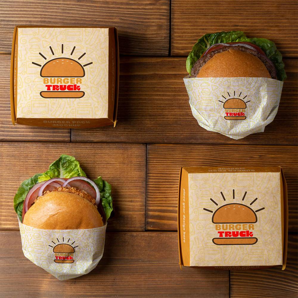 Set of custom sandwich boxes and wrapped burgers with 'Burger Truck' branding, showcasing creative lunch packaging for food storage.