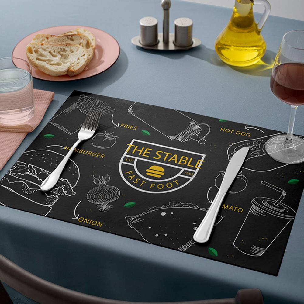 Custom table mat with fast food icons and logo, ideal for themed dining experiences and protecting tables from spills and scratches.